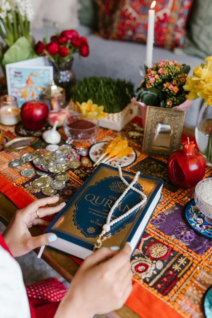 A vibrant Nowruz table set with traditional items and a holy book, celebrating Persian New Year.